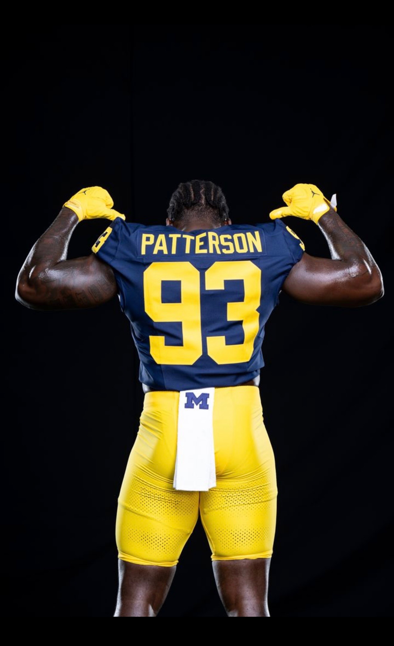 Benny Patterson III running through a football drill