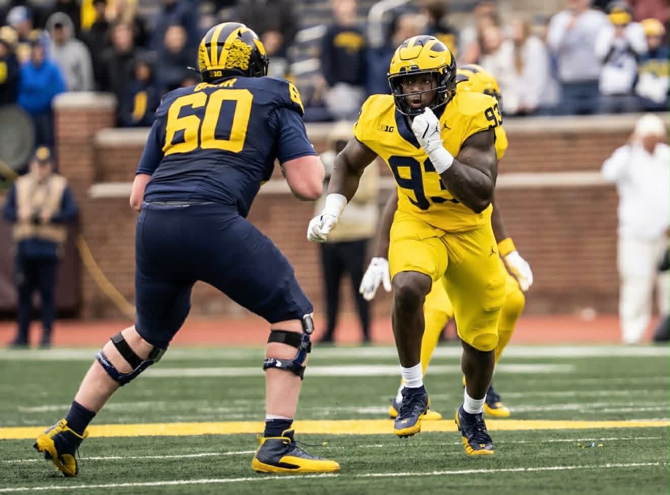 Benny Patterson III running through a football drill