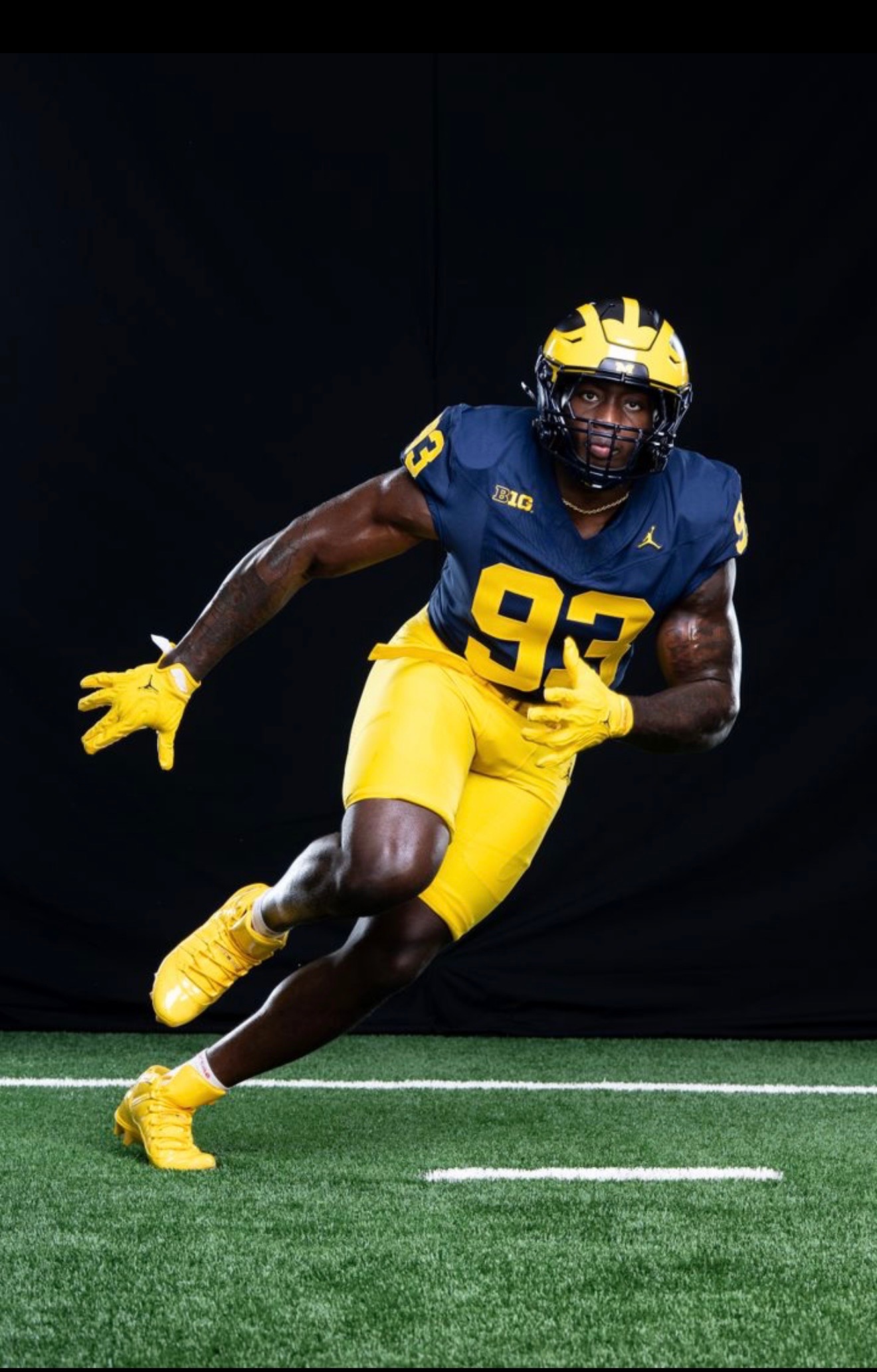 Benny Patterson III running through a football drill